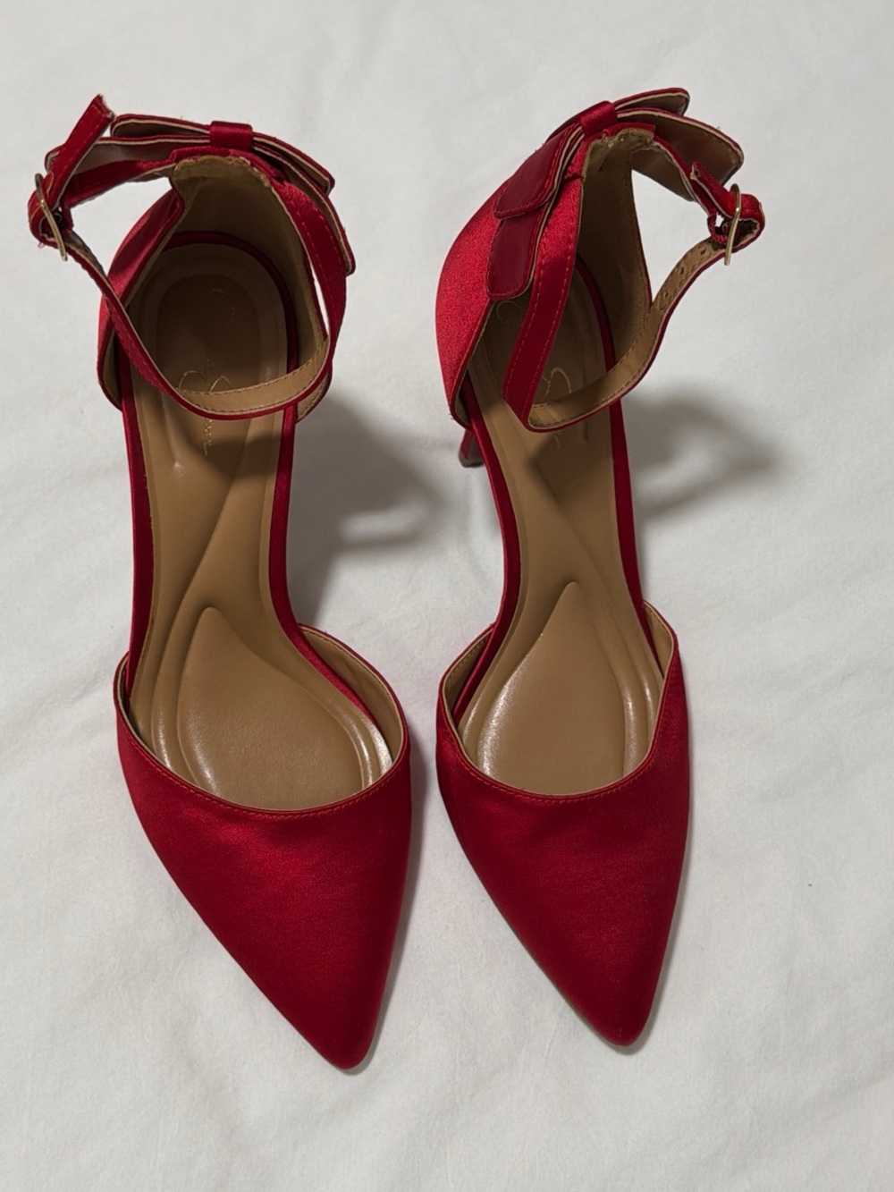 Red satin pointed toe heels with ankle strap